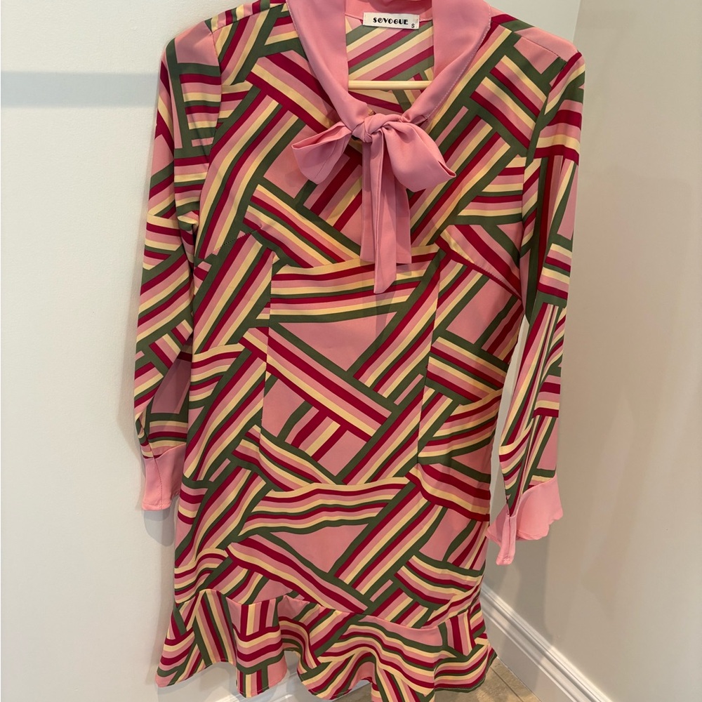 Pink and green dress with bell sleeves and bow neck